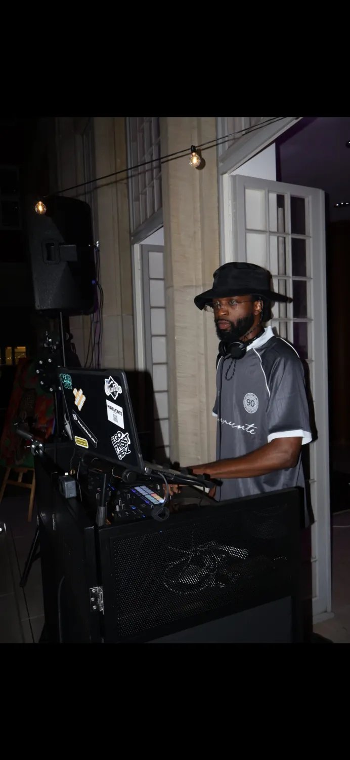 DENBO DJing at an open-air set