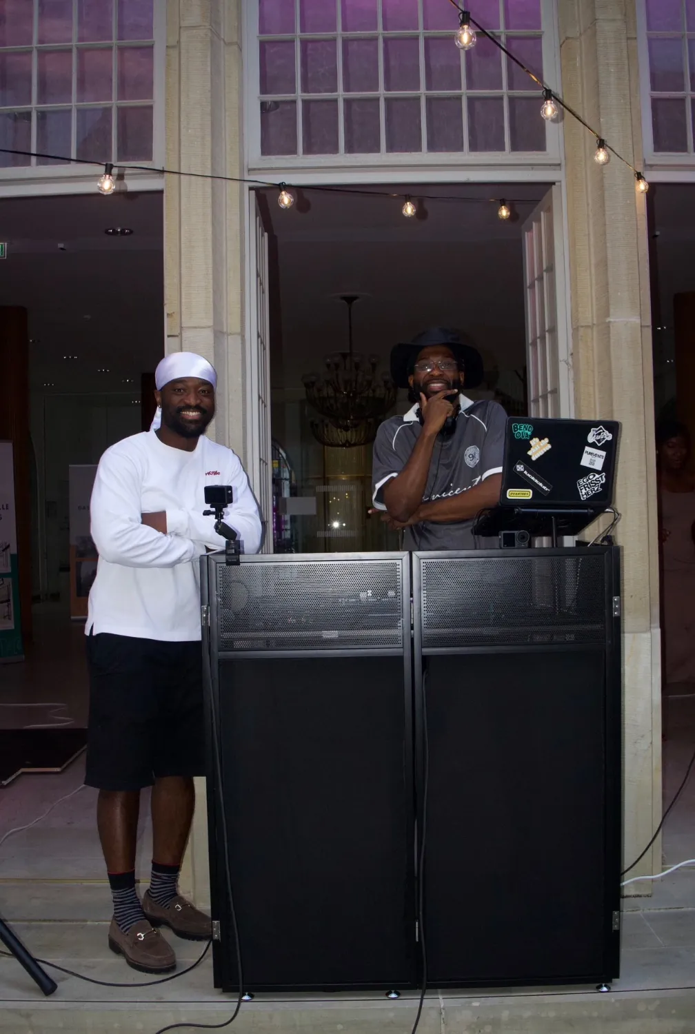 DENBO and a guest behind the DJ booth